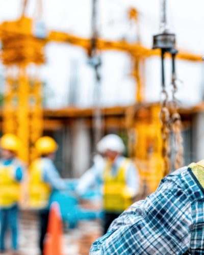 Hyper-realistic construction scene captured in 8K, featuring a construction worker in safety vest and helmet, actively working or observing at a high-rise building site. Cranes, scaffolding, steel beams, and modern structural elements form the backdrop under bright daylight. The image highlights the scale of the site, the focus of the worker, and the energy of industrial progress. Perfect for cover visuals, editorial articles, and corporate construction campaigns, with vibrant lighting, strong composition, and natural shadows. Man climbing ladder to scaffolding platform with sunrise glow --chaos 80 --ar 16:9 --v 7 Job ID: 8be450c9-62f3-49c7-bf4a-7a92c06dddaa